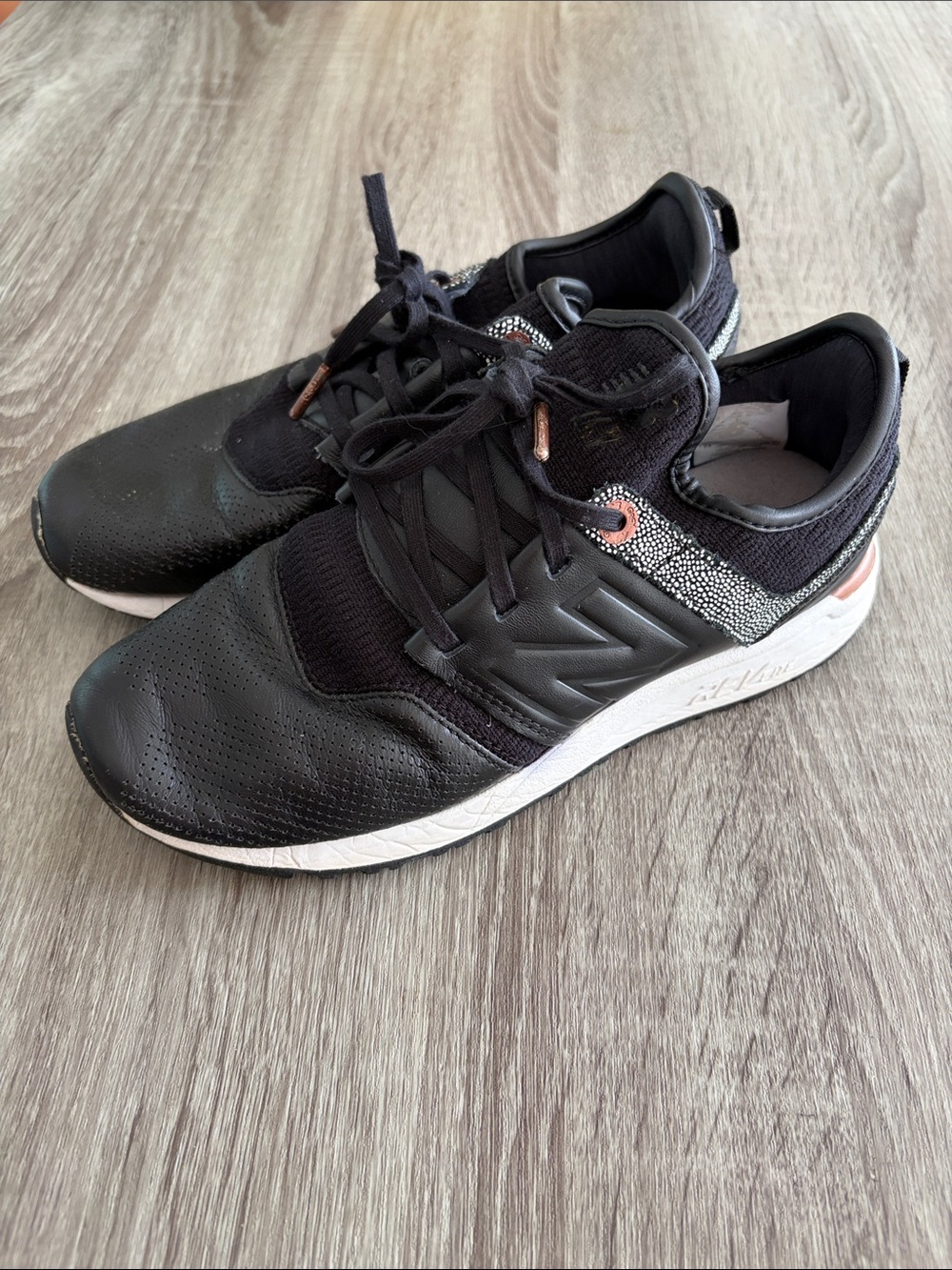 New Balance Women’s Black Sneakers with Rose Metallic Accents
